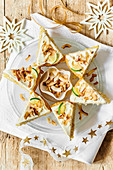Lime cake with coconut shavings arranged in a star shape (Christmas)
