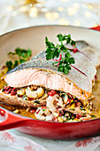 Salmon fillet filled with prawns, bell peppers and pine nuts
