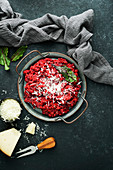 Beetroot risotto with hard cheese and caramelized leaves