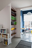 Bookshelves in anteroom with view into the study