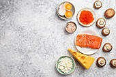 Selection of natural sources of vitamin D (Fish, cheese, eggs, mushrooms)