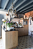 Rustic kitchen in Mediterranean vintage style with grey beamed ceiling