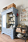 Crockery in open-fronted dresser and vintage accessories