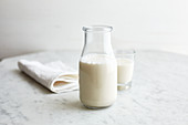 Almond milk in a bottle and a glass