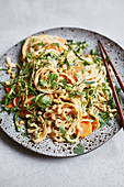 Oriental chard and rice noodle salad with coriander and peanuts