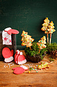 Red motif biscuits (glove, cap) and fir trees on a stick