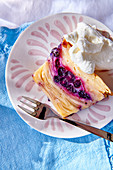 Apple and blueberry cake with whipped cream