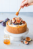 Fig walnut cheesecake drizzled with honey