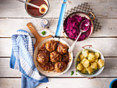 Meatballs with red cabbage and parsley potatoes