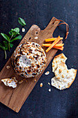 Goat's cheese ball with sardines and mint