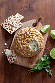 Cheese ball with avocado, cashew nuts and sesame
