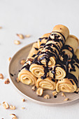 Crepes with chocolate sauce and hazelnuts
