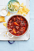 One-pot butternut and beef chilli with tortilla chips