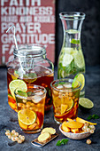 Homemade iced tea with fruits and ginger
