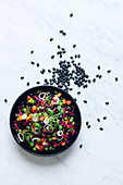 Black bean salad with mango and green peas