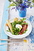 Soft boiled egg, bacon and watercress salad