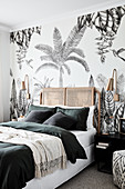 Wallpaper with exotic palm-tree motif in Bohemian-style bedroom
