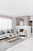 Elegant living room decorated in light grey and pale colours