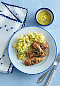 Cevapcici with young spinach and mashed potatoes
