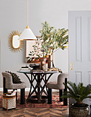 Dining room in colonial style with modern upholstered chairs and rattan table