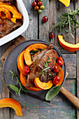 Duck in herbs roasted with pumpkin