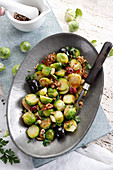 Salad made of brussels sprouts, olives and nuts