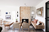 Boho-style living room in natural tones with open fireplace
