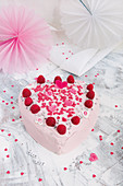 A heart-shaped tutti frutti cake