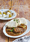 Boiled beef filet with pickled cucumber sauce and Bohemian dumplings