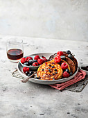 Pancakes with summer berries and maple syrup