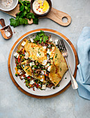 Pancakes filled with peas, feta cheese, peppers and minced meat