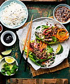 Korean-inspired lettuce wraps with beef and sesame seeds
