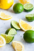 Lemons and limes, whole, halved and slices
