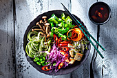 Seaweed bowl with carrots, tofu, red cabbage, zucchini and beech mushrooms