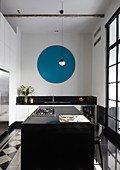 Blue circle on wall of modern kitchen with island counter