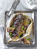 Carp with oyster mushrooms and onion au papillote