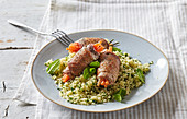 Carrot filled lamb rolls with couscous
