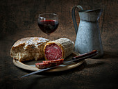 Italian salami, bread and red wine