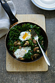 Kale with mushrooms and eggs