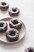 Donuts with chocolate glaze and coconut shreds