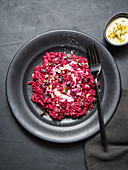 Buckwheat and beetroot risotto with cashew nut 'cream' and roasted walnuts