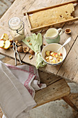 Oat porridge with apple, honey and nuts on a rustic wooden table