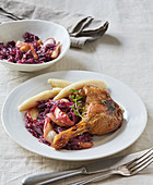 Duck legs and red cabbage with apple