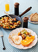 Roasted potatoes and sweet potatoes with an egg