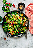 asparagus bread salad with spinach, cucumber and tomato