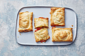 Pizza pockets with capers, olives and courgettes