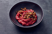 Mashed beetroot and potatoes with crispy onions