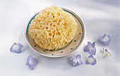 A bath sponge on a plate