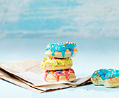 Donuts with colored frosting and sugar sprinkles