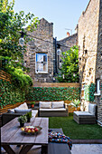 Cozy terrace in the courtyard between brick houses